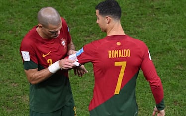 06.12.2022. FIFA World Cup 2022, Round of 16 Portugal v Switzerland.  Cristiano Ronaldo of Portugal comes on and is handed captains armband by Pepe of Portugal 

Material must be credited "The Sun/News Licensing" unless otherwise agreed. 100% surcharge if not credited. Online rights need to be cleared separately. Strictly one time use only subject to agreement with News Licensing