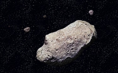 Ida, Ida, discovered by the Galileo probe in 1993, is 52 km long and has a tiny moon, Dactyl. (Photo by: QAI Publishing/Universal Images Group via Getty Images)