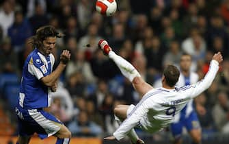 Real Madrid's Roberto Soldado (R) kicks the ball next Espanyol's Daniel Jarque (L) during a Spanish league football match at the Santiago Bernabeu Stadium on March 08, 2008 in Madrid. Real Madrid won the match 2-1. AFP PHOTO / MIGUEL RIOPA (Photo credit should read MIGUEL RIOPA/AFP via Getty Images)