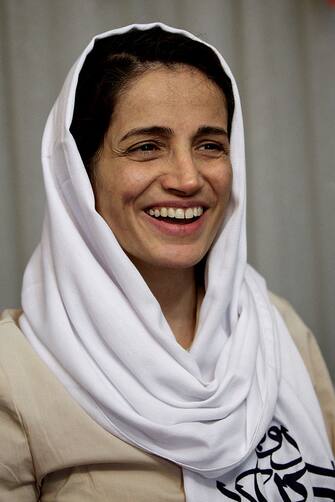 Iranian lawyer Nasrin Sotoudeh smiles at her house in Tehran on September 18, 2013, after being freed after three years in prison. Sotoudeh told AFP she was in "good" physical and psychological condition, and pledged to continue her human rights work. Her release came a week before Irans new moderate President Hassan Rowhani, who has promised more freedoms at home and constructive engagement with the world, travels to New York to attend the United Nations General Assembly.  AFP PHOTO/BEHROUZ MEHRI        (Photo credit should read BEHROUZ MEHRI/AFP via Getty Images)