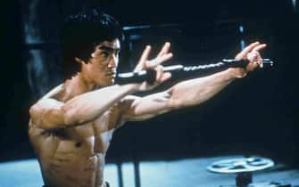 Chinese-American martial arts exponent Bruce Lee (1940 - 1973), in a still from the film 'Enter The Dragon', directed by Robert Crouse for Warner Brothers, 1973. (Photo by Fotos International/Archive Photos/Getty Images)
