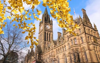 Manchester - city in North West England (UK). City Hall. Autumn leaves colors.