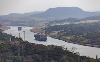 huge cargo ships crossing the panama canal from the caribian to the pacific.