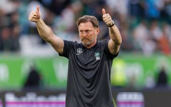 WOLFSBURG, GERMANY - APRIL 7: Head coach Ralph HasenhÃ¼ttl of VfL Wolfsburg shows thumbs up to the fans after the Bundesliga match between VfL Wolfsburg and Borussia MÃ¶nchengladbach at Volkswagen Arena on April 7, 2024 in Wolfsburg, Germany.(Photo by Max Ellerbrake - firo sportphoto/Getty Images)