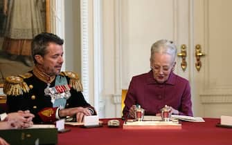 epa11076133 Denmark's Queen Margrethe (R) signs a declaration of abdication next to Crown Prince Frederik in the Council of State at Christiansborg Castle in Copenhagen, Denmark, 14 January 2024. Denmark's Queen Margrethe II announced in her New Year's speech on 31 December 2023 that she would abdicate on 14 January 2024, the 52nd anniversary of her accession to the throne. Her eldest son, Crown Prince Frederik, is set to succeed his mother on the Danish throne as King Frederik X. His son, Prince Christian, will become the new Crown Prince of Denmark following his father's coronation.  EPA/MADS CLAUS RASMUSSEN DENMARK OUT