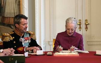 epa11076133 Denmark's Queen Margrethe (R) signs a declaration of abdication next to Crown Prince Frederik in the Council of State at Christiansborg Castle in Copenhagen, Denmark, 14 January 2024. Denmark's Queen Margrethe II announced in her New Year's speech on 31 December 2023 that she would abdicate on 14 January 2024, the 52nd anniversary of her accession to the throne. Her eldest son, Crown Prince Frederik, is set to succeed his mother on the Danish throne as King Frederik X. His son, Prince Christian, will become the new Crown Prince of Denmark following his father's coronation.  EPA/MADS CLAUS RASMUSSEN DENMARK OUT