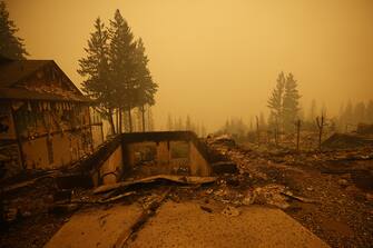 Property and homes razed by a wildfire in Celista, British Columbia, Canada, on Saturday, Aug. 19, 2023. Record-breaking wildfires in Canada, which have already scorched an area larger than Greece, are heading toward key population centers, forcing tens of thousands to evacuate. Photographer: Cole Burston/Bloomberg via Getty Images