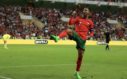 epa11404832 Portugal's Cristiano Ronaldo celebrates after scoring a goal during the friendly international soccer match between Portugal and Ireland in Aveiro, Portugal, 11 June 2024.  EPA/JOSE COELHO