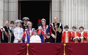 (Left to right) The Duke of Edinburgh, the Earl of Wessex, Lady Louise Windsor, Vice Admiral Timothy Laurence, the Duchess of Edinburgh, Princess Charlotte, the Princess Royal, the Princess of Wales, Prince Louis, the Prince of Wales and the Pages of Honour including Prince George (second from right) on the balcony of Buckingham Palace, London, following the coronation. Picture date: Saturday May 6, 2023.