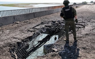 RUSSIA, KHERSON REGION - JUNE 23, 2023: An employee of the Russian Investigative Committee visits a bridge damaged by a Ukrainian strike near the village of Chongar. According to acting Kherson Region Governor Saldo, Ukraine has hit bridges between the region and Crimea, using what appears to be British cruise missiles Storm Shadow. Alexander Polegenko/TASS/Sipa USA