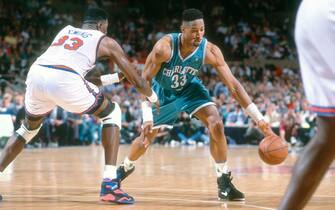 NEW YORK - CIRCA 1993:  Alonzo Mourning #33 of the Charlotte Hornets dribbles the ball while closely guarded by Patrick Ewing #33 of the New York Knicks during an NBA basketball game circa 1993 at Madison Square Garden in the Manhattan borough of New York City. Mourning played for the Hornets from 1992-95. (Photo by Focus on Sport/Getty Images) *** Local Caption *** Alonzo Mourning; Patrick Ewing