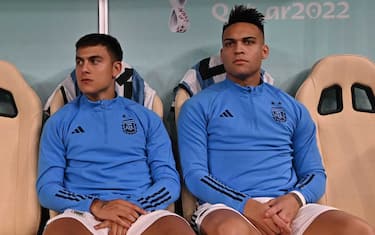 epa10364124 Lautaro Martinez (R) and Paulo Dybala of Argentina sit on the bench before the FIFA World Cup 2022 semi final between Argentina and Croatia at Lusail Stadium in Lusail, Qatar, 13 December 2022.  EPA/Noushad Thekkayil