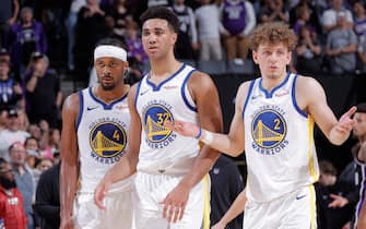 SACRAMENTO, CA - OCTOBER 15: Moses Moody #4, Trayce Jackson-Davis #32, and Brandin Podziemski #2 of the Golden State Warriors look on during the game against the Sacramento Kings on October 15, 2023 at Golden 1 Center in Sacramento, California. NOTE TO USER: User expressly acknowledges and agrees that, by downloading and or using this photograph, User is consenting to the terms and conditions of the Getty Images Agreement. Mandatory Copyright Notice: Copyright 2023 NBAE (Photo by Rocky Widner/NBAE via Getty Images)
