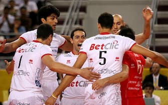 Italian club Trentino BetClic's player celebrate winning a point agains Poland's PGE Skra Belchatow during the final match of the FIVB Men's Volleyball Clubs World Championship in Doha, Qatar on November 8, 2009. AFP PHOTO/KARIM JAAFAR (Photo credit should read KARIM JAAFAR/AFP via Getty Images)