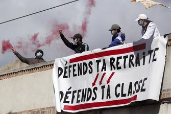 epa10570632 A banner reads 'defend your retirement, defend your class' as people attend a rally against the government's reform to the pension system in Montpellier, France, 13 April 2023. The 'sages', members of the Constitutional Council, are due to deliver their verdict on 14 April concerning the examination of the text of the pension reform, almost one month after the country's prime minister announced the use of article 49.3 of the French Constitution to have the text of the controversial bill to be definitively adopted without a vote. The reform would raise the retirement age in France from 62 to 64.  EPA/Guillaume Horcajuelo