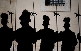 Swiss Guards stand at San Damaso courtyard prior to the arrival of the Prime Minister of Ukraine Denys Shmyhal for a meeting with Pope Francis at the Vatican on April 27, 2023. (Photo by Vincenzo PINTO / AFP) (Photo by VINCENZO PINTO/AFP via Getty Images)