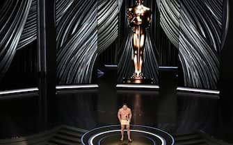 US actor John Cena presents the award for Best Costume Design onstage during the 96th Annual Academy Awards at the Dolby Theatre in Hollywood, California on March 10, 2024. (Photo by Patrick T. Fallon / AFP) (Photo by PATRICK T. FALLON/AFP via Getty Images)
