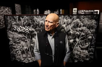 LOS ANGELES, CALIFORNIA - OCTOBER 19: Brazilian documentary photographer SebastiÃ£o Salgado stands for a photo at a press preview of his exhibit AmazÃ´nia at the California Science Center on October 19, 2022 in Los Angeles, California. The 13,000 square-foot immersive exhibit, designed by his wife LÃ©lia Wanick Salgado, features 200 large-scale photographs and video montages taken over seven years of the Amazon rainforest, remote Indigenous tribes, and the threat deforestation poses to their survival. Salgado says, 'My wish, with all my heart, with all my energy, with all the passion I possess, is that in 50 years' time this exhibition will not resemble a record of a lost world.' The exhibit is making its North American debut on October 21st and is supported by the Annenberg Foundation. (Photo by Mario Tama/Getty Images)