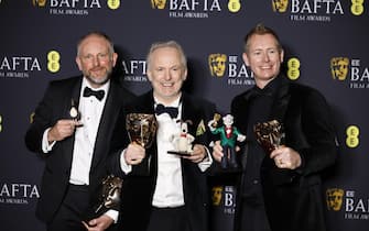 epa11901462 (L-R) Richard Beek, Nick Park, and Merlin Crossingham pose in the press room after winning the Children's and Family Film award for 'Wallace and Gromit: Vengeance Most Fowl' during the BAFTA Film Awards at the Royal Festival Hall in London, Britain, 16 February 2025. The ceremony is hosted by the British Academy of Film and Television Arts (BAFTA).  EPA/TOLGA AKMEN