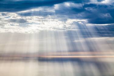 Sunbeams over the Atlantic Ocean, Timanfaya National Park, Lanzarote, Canary Islands, Spain