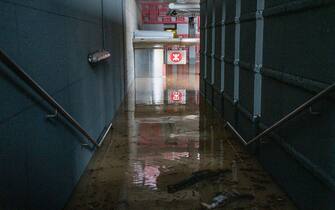 The muddy floor of the Wong Tai Sin MTR station is pictured in Hong Kong on September 8, 2023, following major flooding. Record rainfall in Hong Kong caused widespread flooding in the early hours on September 8, disrupting road and rail traffic just days after the city dodged major damage from a super typhoon. (Photo by Bertha WANG / AFP) (Photo by BERTHA WANG/AFP via Getty Images)