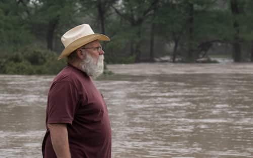 COMFORT, TEXAS - JULY 04: Comfort resident Reagan Arnold observes rising water levels near his home along the Guadalupe River on July 4, 2025 in Comfort, Texas. Heavy rainfall caused flooding along the Guadalupe River in central Texas with multiple fatalities reported. (Photo by Eric Vryn/Getty Images)