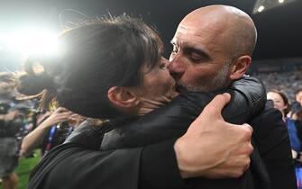 11 June 2023, Turkey, Istanbul: Champions League, Manchester City - Inter Milan, knockout round, final, at the Ataturk Olympic Stadium. Manchester's coach Pep Guardiola kisses his wife Cristina after the match. Manchester wins 1:0. Photo: Robert Michael/dpa (Photo by Robert Michael/picture alliance via Getty Images)