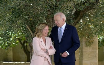 US President Joe Biden is welcomed by Italy's Prime Minister Giorgia Meloni upon arrival at the Borgo Egnazia resort for the G7 Summit hosted by Italy in Apulia region, on June 13, 2024 in Savelletri. Leaders of the G7 wealthy nations gather in southern Italy this week against the backdrop of global and political turmoil, with boosting support for Ukraine top of the agenda. (Photo by Tiziana FABI / AFP)