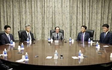 Kazuo Ueda, governor of the Bank of Japan (BOJ), center, attends a monetary policy meeting with deputy governors, Ryozo Himino, second left, and Shinichi Uchida, left, and Ryosei Akazawa, Japan's state minister of finance, second right, and Tatsunori Ibayashi, Japan's state minister of cabinet office, right, at the central bank's headquarters in Tokyo, Japan, on Tuesday, Jan. 23, 2024. The BOJ is expected to keep its main monetary policy settings steady when it announces the outcome of its meeting Tuesday. Photographer: Kiyoshi Ota/Bloomberg via Getty Images