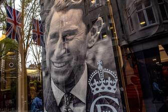 epa10608469 A portrait of King Charles III is placed on a shop window in London, Britain, 04 May 2023. Britain's King Charles III's Coronation takes place at Westminster Abbey on 06 May 2023.  EPA/MARTIN DIVISEK