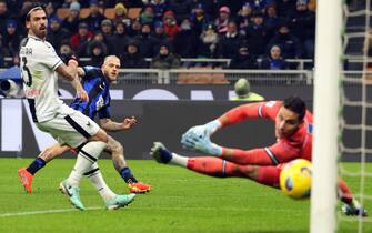 Inter Milan’s Federico Dimarco (C) scores goal of 2 to 0 against Udinese’s goalkeeper Marco Silvestri during the Italian serie A soccer match between Fc Inter  and Udinese Giuseppe Meazza stadium in Milan, 9  December 2023.
ANSA / MATTEO BAZZI