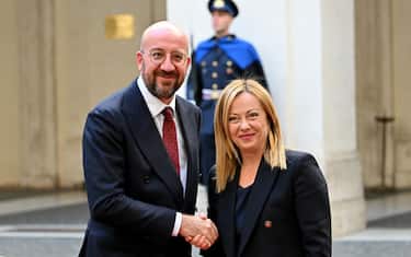 Italys Prime Minister Giorgia Meloni shakes hands with President of the European Council Charles Michel at Chigi palace on January 30, 2023 in Rome. (Photo by Alberto PIZZOLI / AFP) (Photo by ALBERTO PIZZOLI/AFP via Getty Images)
