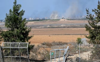 KFAR AZA, ISRAEL - OCTOBER 10: Smoke rises in the distance from Gaza near the spot where Hamas militants broke through the kibbutz Kfar Aza's fence days earlier, in a attack on this kibbutz near the border with Gaza, on October 10, 2023 in Kfar Aza, Israel. Israel has sealed off Gaza and conducted airstrikes on Palestinian territory after an attack by Hamas killed hundreds and took more than 100 hostages. On October 7, the Palestinian militant group Hamas launched a surprise attack on Israel from Gaza by land, sea, and air, killing over 700 people and wounding more than 2000. Israeli soldiers and civilians have also been taken hostage by Hamas and moved into Gaza. The attack prompted a declaration of war by Israeli Prime Minister Benjamin Netanyahu, and ongoing retaliatory strikes by Israel on Gaza killing hundreds.(Photo by Alexi J. Rosenfeld/Getty Images)