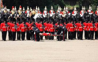 LONDON, ENGLAND - JUNE 10: A Welsh Guardsman is stretchered away while Prince William, Prince of Wales Carries Out The Colonel's Review at Horse Guards Parade on June 10, 2023 in London, England. The Prince of Wales carried out the review of the Welsh Guards for the first time as Colonel of the Regiment. It is the final evaluation of the King's Birthday parade ahead of the event on June 17.  (Photo by Tristan Fewings/Getty Images)
