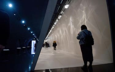 A visitor takes a photo of the Raytrace installation by BenjaminHubert at the Fuori Salone (Outdoor Fair) part of the Milan Design Week in Milan, Italy, 12 April 2019. The Milan Design Week runs from 09 to 14 April and presents the latest trends and designs on furniture, lighting and home accessories. ANSA/DANIEL DAL ZENNARO