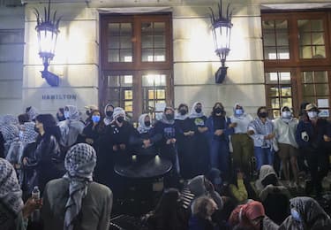 NEW YORK, UNITED STATES - APRIL 30: A group of Columbia University students, advocating for Palestinians, access the iconic Hamilton Hall building as they gather to stage a demonstration at the campus in New York, United States on April 30, 2024. Protests are sweeping college campuses across the US following a police attempt to clear a pro-Palestinian encampment at Columbia University, resulting in the arrest of over 100 students. Columbia University asked students on Monday to 'voluntarily disperse' amid stalled talks, threatening the students with suspension. (Photo by Selcuk Acar/Anadolu via Getty Images)