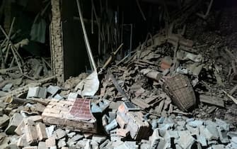 A view of the debris of a house brought down in the earthquake in Jishishan county in northwest China's Gansu province Tuesday, Dec. 19, 2023. A magnitude-6.2 earthquake jolted the remote and mountainous county around midnight on Tuesday, killing at least 111 people and injuring more than 230, according to Chinese state media.  (Photo by FEATURECHINA/Newscom/Sipa USA)