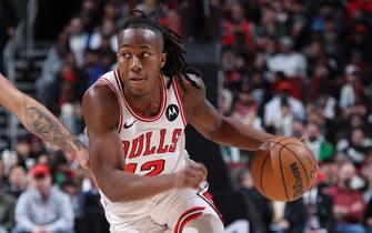 CHICAGO, IL - MARCH 16: Ayo Dosunmu #12 of the Chicago Bulls dribbles the ball during the game against the Washington Wizards on March 16, 2024 at United Center in Chicago, Illinois. NOTE TO USER: User expressly acknowledges and agrees that, by downloading and or using this photograph, User is consenting to the terms and conditions of the Getty Images License Agreement. Mandatory Copyright Notice: Copyright 2024 NBAE (Photo by Jeff Haynes/NBAE via Getty Images)