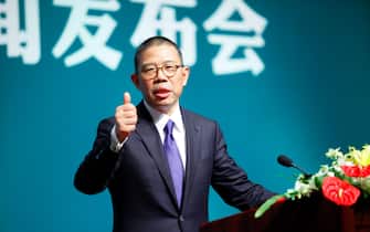 BEIJING, CHINA - MAY 06: Zhong Shanshan, founder and chairman of bottled water company Nongfu Spring, thumbs up at a Nongfu Spring press conference on May 6, 2013 in Beijing, China. (Photo by VCG/VCG via Getty Images)