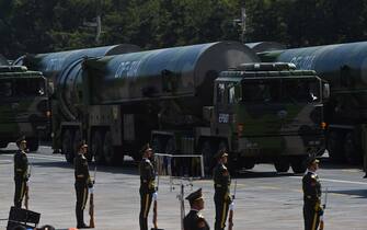 Military vehicles carrying DF-31A ballistic missiles participate in a military parade at Tiananmen Square in Beijing on September 3, 2015, to mark the 70th anniversary of victory over Japan and the end of World War II. China kicked off a huge military ceremony marking the 70th anniversary of Japan's defeat in World War II on September 3, as major Western leaders stayed away. AFP PHOTO / GREG BAKER        (Photo credit should read GREG BAKER/AFP via Getty Images)