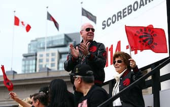 TORONTO, ON - JUNE 17:  Larry Tanenbaum, chairman of MLSE, owners of the Toronto Raptors, waves to the crowd during the Toronto Raptors Victory Parade on June 17, 2019 in Toronto, Canada. The Toronto Raptors beat the Golden State Warriors 4-2 to win the 2019 NBA Finals.  NOTE TO USER: User expressly acknowledges and agrees that, by downloading and or using this photograph, User is consenting to the terms and conditions of the Getty Images License Agreement.  (Photo by Vaughn Ridley/Getty Images)