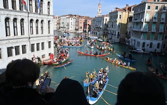 Decorated boats sail on the Grand Canal during Venice Carnival, on February 16, 2025. This year, the theme of one of the most famous carnival in the world is Casanova, as the 'Serenissima' celebrates the 300th anniversary of the famous man's birth. (Photo by ANDREA PATTARO / AFP)