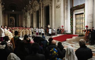 Pope Francis (3rd L) celebrates Christmas Eve Mass on the day of the opening of the Holy Door of St Peter's Basilica, to mark the launch of the Jubilee 2025, a year of Catholic celebrations set to draw more than 30 million pilgrims to Rome, at the Vatican, on December 24, 2024. (Photo by Remo Casilli / POOL / AFP)