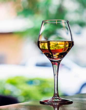 glass of traditional spanish jerez sweet sherry wine in outdoor cafe table