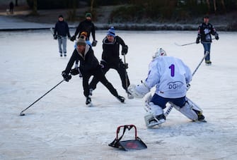Glasgow, Scotland, UK. 3 January 2021. Keen amateur ice hockey players and a few figure skaters took advantage of freezing temperatures and a rare frozen pond at Queens Park in  Glasgow this morning. Iain Masterton/Alamy Live News