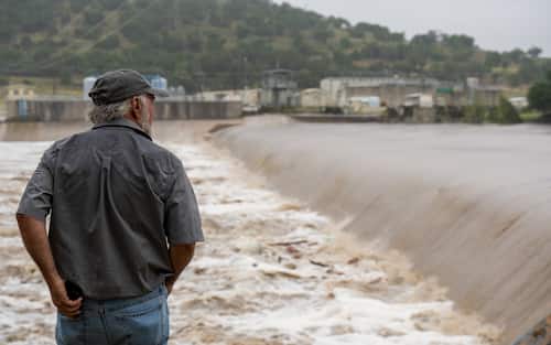 KERRVILLE, TEXAS - JULY 04: A Kerrville resident watches the rising waters of the Guadalupe River on July 4, 2025 in Kerrville, Texas. Heavy rainfall caused flooding along the Guadalupe River in central Texas with multiple fatalities reported. (Photo by Eric Vryn/Getty Images)