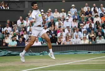 epa10749938 Novak Djokovic of Serbia in action during the Men's Singles final match against Carlos Alcaraz of Spain at the Wimbledon Championships, Wimbledon, Britain, 16 July 2023.  EPA/TOLGA AKMEN   EDITORIAL USE ONLY