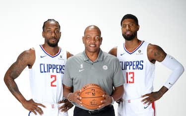 PLAYA VISTA, CA - SEPTEMBER 29: Kawhi Leonard #2, Head Coach Doc Rivers, and Paul George #13 of the LA Clippers pose for a portrait during media day on September 29, 2019 at the Honey Training Center: Home of the LA Clippers in Playa Vista, California. NOTE TO USER: User expressly acknowledges and agrees that, by downloading and/or using this photograph, user is consenting to the terms and conditions of the Getty Images License Agreement. Mandatory Copyright Notice: Copyright 2019 NBAE (Photo by Andrew D. Bernstein/NBAE via Getty Images)