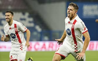 Monza's Lorenzo Colombo jubilates with his teammates after scoring the goal during the Italian Serie A soccer match US Sassuolo vs AC Monza at Mapei Stadium in Reggio Emilia, Italy, 2 October 2023. ANSA /ELISABETTA BARACCHI