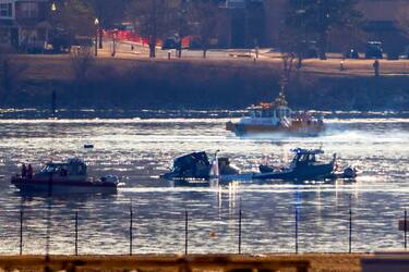 epa11863855 Emergency crews operate on the Potomac River near the wreckage of a commercial airplane that collided with a military helicopter, in Washington, DC, USA, 30 January 2025. DC Fire and EMS Chief John Donnelly said no survivors are expected following the collision of an American Eagle Flight, with 60 passengers and four crew members on board, with a US Army Black Hawk helicopter carrying three US service members late on 29 January, over the Potomac River near Reagan Washington National Airport.  EPA/SHAWN THEW